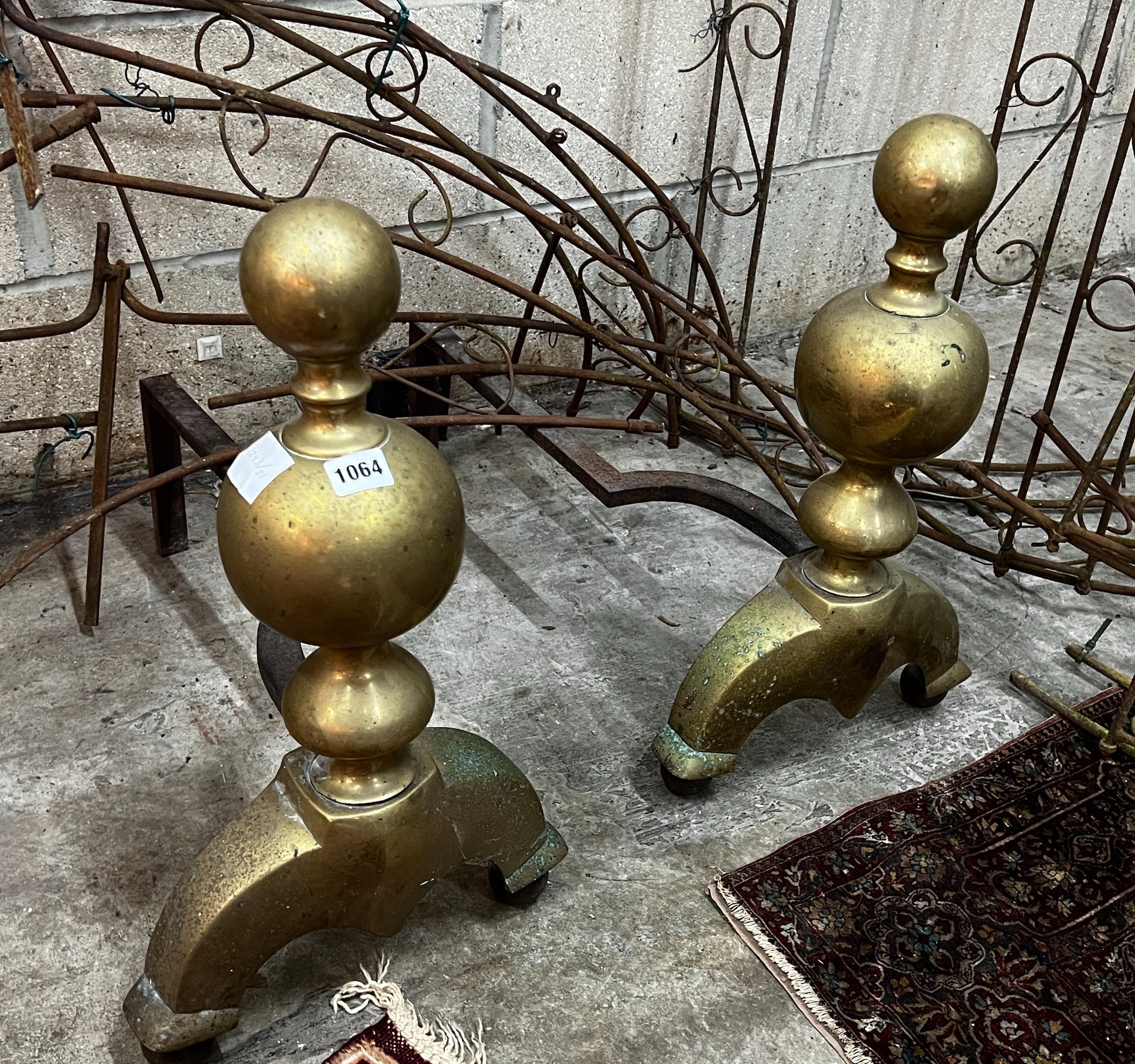 A pair of large 17th century style brass and wrought iron fire dogs, height 56cm